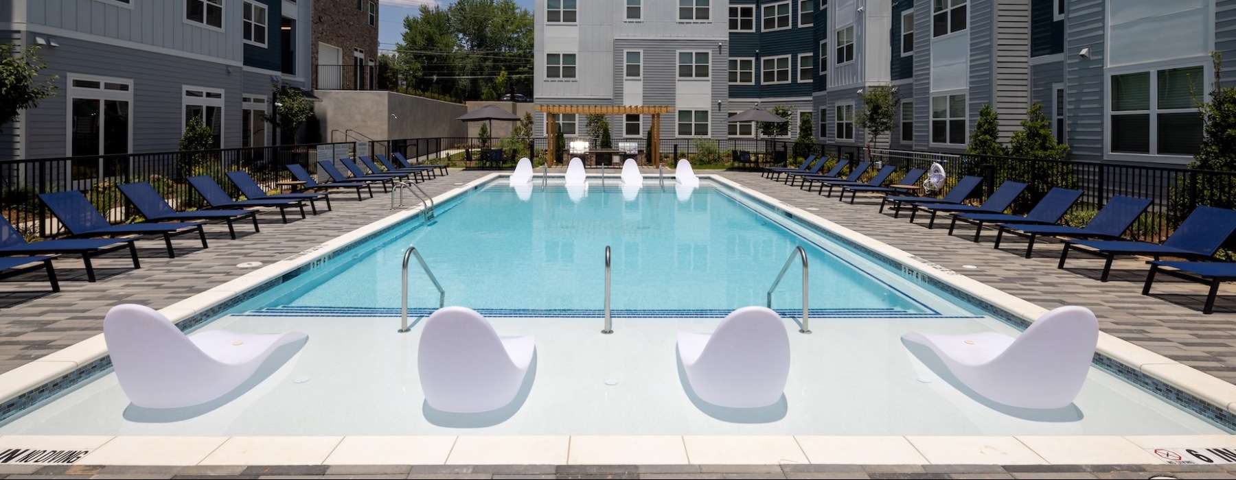 Resort style pool with lounge chairs