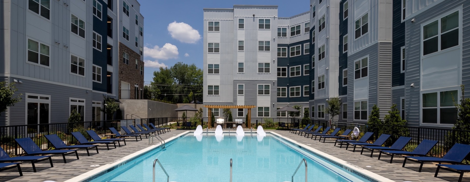 Resort style pool with lounge chairs